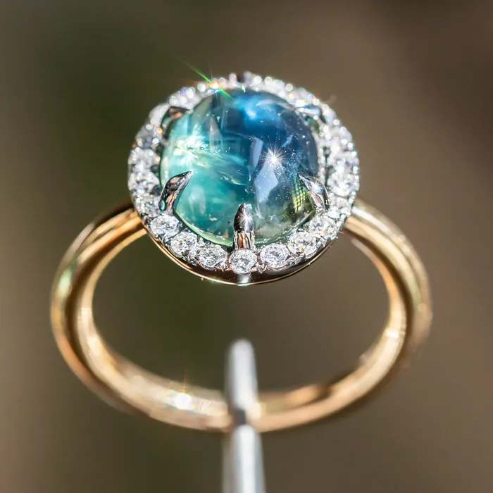 448ct Oval Cabochon Parti Sapphire and Antiqued Diamond Halo ring in 18k Yellow Gold Anueva Jewelry Rings