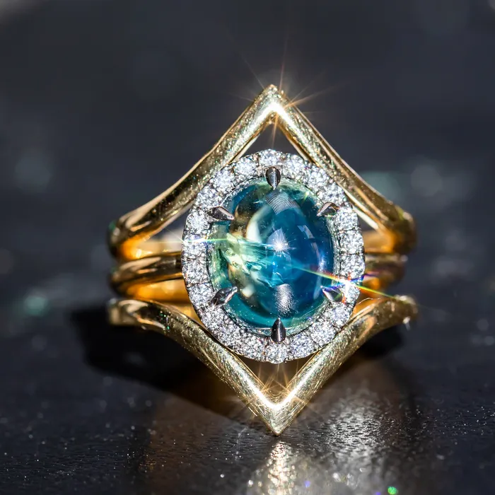 448ct Oval Cabochon Parti Sapphire and Antiqued Diamond Halo ring in 18k Yellow Gold Anueva Jewelry Rings