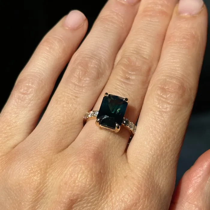 Rings 612ct Deep Teal Blue Madagascar Radiant Cut Sapphire Solitaire Ring with French Set Diamonds in 18k Yellow Gold Anueva Jewelry