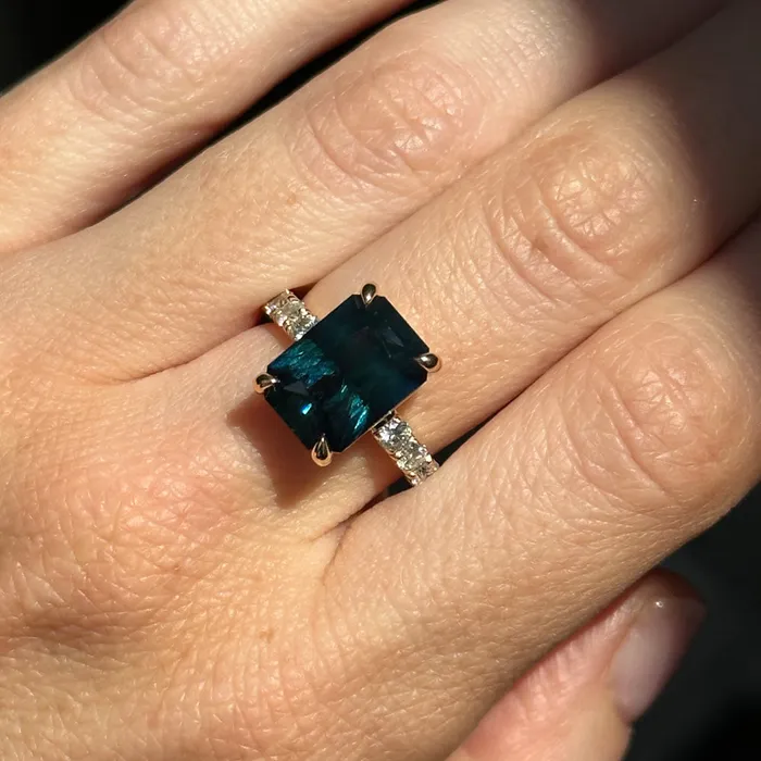 Rings 612ct Deep Teal Blue Madagascar Radiant Cut Sapphire Solitaire Ring with French Set Diamonds in 18k Yellow Gold Anueva Jewelry