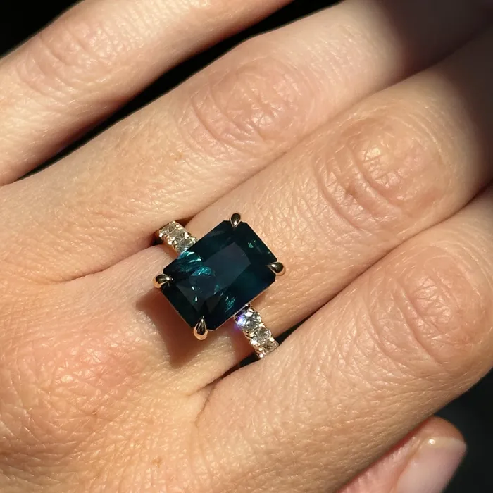 Rings 612ct Deep Teal Blue Madagascar Radiant Cut Sapphire Solitaire Ring with French Set Diamonds in 18k Yellow Gold Anueva Jewelry