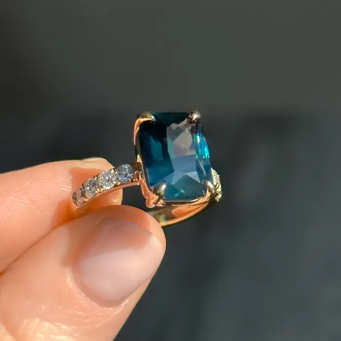 Rings 612ct Deep Teal Blue Madagascar Radiant Cut Sapphire Solitaire Ring with French Set Diamonds in 18k Yellow Gold Anueva Jewelry