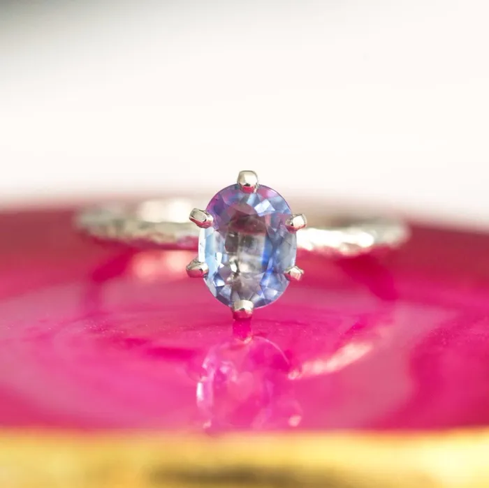 Rings Anueva Jewelry Light Periwinkle Blue Oval Sapphire Ring in Hand Carved Recycled Platinum Earthy Setting Sixprong Sapphire Engagement Ring by Anueva Jewelry Rings Anueva Jewelry Light Periwinkle Blue Oval Sapphire Ring in Hand Carved Recycled Platinum Earthy Setting Sixprong Sapphire Engagement Ring by Anueva Jewelry