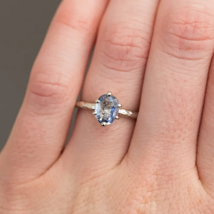 Rings Anueva Jewelry Light Periwinkle Blue Oval Sapphire Ring in Hand Carved Recycled Platinum Earthy Setting Sixprong Sapphire Engagement Ring by Anueva Jewelry Rings Anueva Jewelry Light Periwinkle Blue Oval Sapphire Ring in Hand Carved Recycled Platinum Earthy Setting Sixprong Sapphire Engagement Ring by Anueva Jewelry