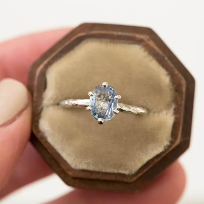 Rings Anueva Jewelry Light Periwinkle Blue Oval Sapphire Ring in Hand Carved Recycled Platinum Earthy Setting Sixprong Sapphire Engagement Ring by Anueva Jewelry Rings Anueva Jewelry Light Periwinkle Blue Oval Sapphire Ring in Hand Carved Recycled Platinum Earthy Setting Sixprong Sapphire Engagement Ring by Anueva Jewelry