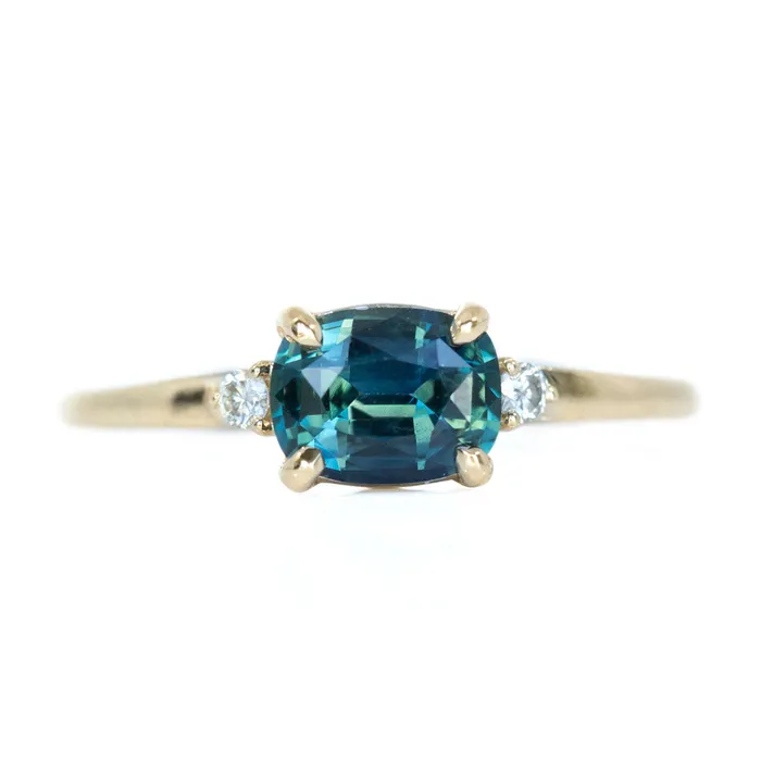Rings Anueva Jewelry Teal Blue Three Stone Ring featuring 115ct cushion sapphire and diamonds in EastWest setting Rings Anueva Jewelry Teal Blue Three Stone Ring featuring 115ct cushion sapphire and diamonds in EastWest setting