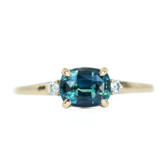 Rings Anueva Jewelry Teal Blue Three Stone Ring featuring 115ct cushion sapphire and diamonds in EastWest setting